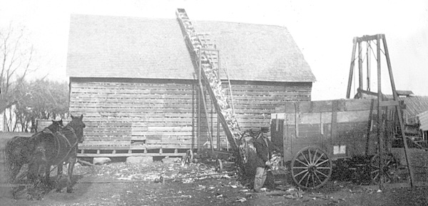 Unloading the day's harvest into the crib, C. E. Grimes farm